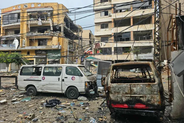 A picture shows damaged buildings and destroyed vehicles following an Israeli airstrike that targeted the Haret Hreik neighborhood in the southern suburbs of the Lebanese capital Beirut on March 21, 2026. (AFP)