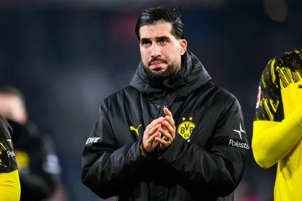 14 December 2025, Baden-Wuerttemberg, Freiburg im Breisgau: Borussia Dortmund's Emre Can thanks the fans after the German Bundesliga soccer match between SC Freiburg and Borussia Dortmund at Europa-Park Stadium. (dpa) 