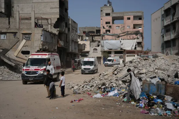 UN vehicles escort ambulances and a bus carrying Palestinian patients in Khan Younis as they travel to the Rafah crossing to leave the Gaza Strip for medical treatment abroad, Thursday, Mar, 19, 2026.(AP Photo/Abdel Kareem Hana)