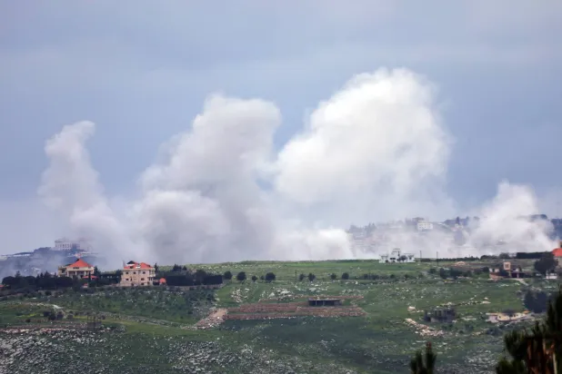 Smoke rises after an Israeli strike, following an escalation between Hezbollah and Israel amid the US-Israeli conflict with Iran, as seen from Marjayoun, Lebanon, March 22, 2026. REUTERS/Karamallah Daher