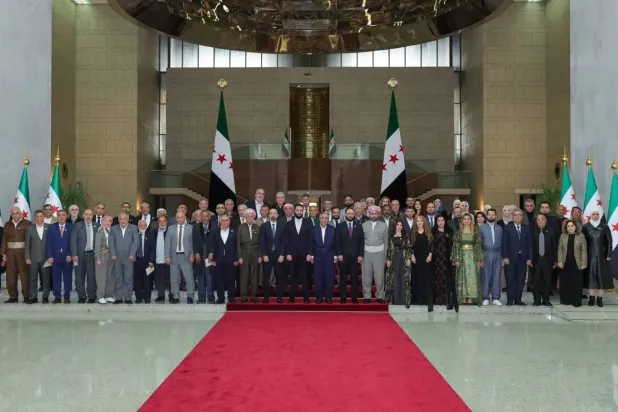 A group photo during Syrian President Ahmed al-Sharaa’s reception in Damascus of a Kurdish delegation marking Eid al-Fitr and Nowruz. (Syrian Presidency) 