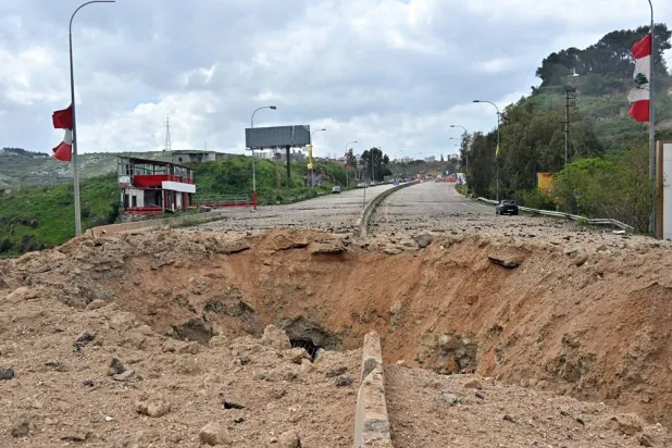 Damage at the site of an Israeli strike targeting the Qasmiye bridge near Tyre, southern Lebanon, 23 March 2026. (EPA)