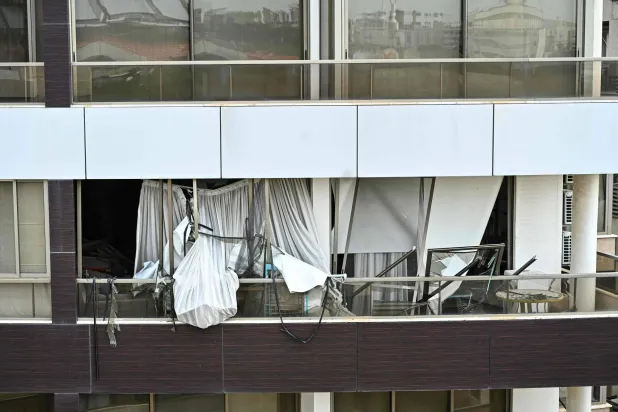 A photograph shows the damage after an Israeli strike targeted an apartment in Hazmieh, on the eastern outskirts of Beirut, on March 23, 2026. (AFP)