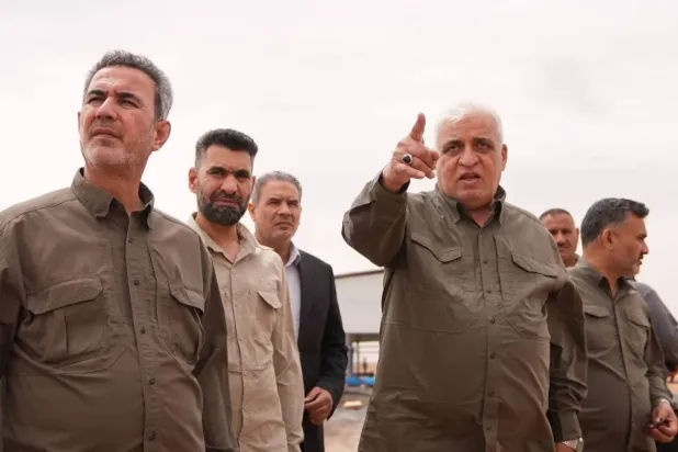 PMF chief Falih al-Fayadh and his chief of staff Abdulaziz al-Muhammadawi. (PMF file photo) 