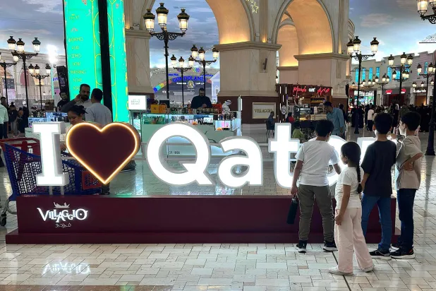 People visit a mall in Doha on March 23, 2026. (Photo by AFP)