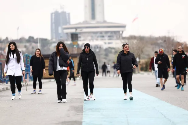 Iranian women walk at Pardisan Park, amid the US-Israeli conflict with Iran, in Tehran, Iran, March 25, 2026. Majid Asgaripour/WANA (West Asia News Agency) via REUTERS  