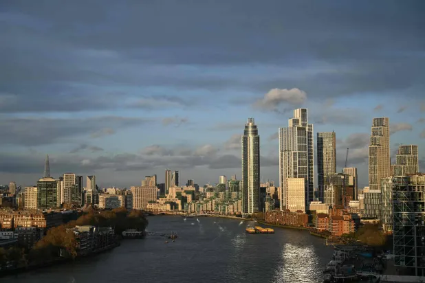 This overhead view shows buildings along the River Thames in London on March 25, 2026. (Photo by JUSTIN TALLIS / AFP)