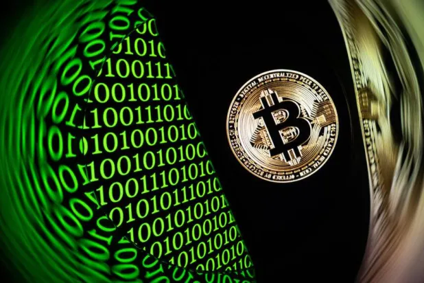 Iranian civilians are turning en masse to bitcoin, which can be stored in personal wallets beyond the authorities' reach. SEBASTIEN BOZON / AFP/File
