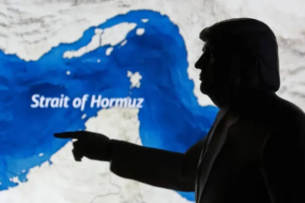 Map showing the Strait of Hormuz, alongside a 3D-printed model of US President Donald Trump (Reuters)