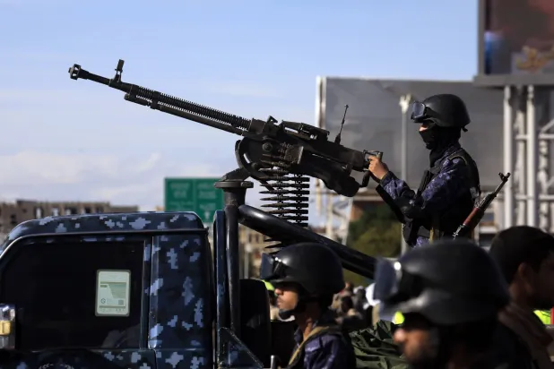 A Houthi member mans a machine gun on a pickup truck while on patrol during a rally in solidarity with Iran in Sanaa, Yemen, 27 March 2026. EPA/YAHYA ARHAB