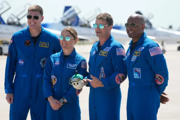Artemis 2 crew members, from left, Mission Spc. Jeremy Hansen, of Canada, Mission Spc. Christina Koch, Commander Reid Wiseman, and Pilot Victor Glover pose for a photo after the crew’s arrival at the Kennedy Space Center Friday, March 27, 2026, in Cape Canaveral, Fla. (AP Photo/Chris O’Meara)
