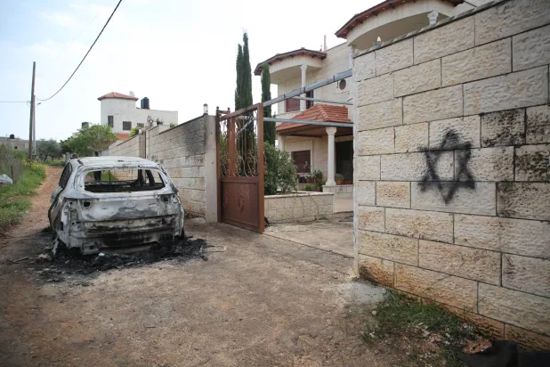 File: Palestinian Territories, Nablus: A view of a damaged vehicle following an attack by Jewish settlers, who also wrote Hebrew slogans on the walls of houses in the village of Deir al-Hatab, east of Nablus in the West Bank. Photo: Mohammed Nasser/APA Images via ZUMA Press Wire/dpa