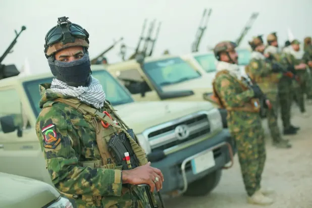 Irak-Suriye sınırı yakınlarında konuşlu Haşdi Şabi üyeleri, 23 Ocak 2026 (DPA)