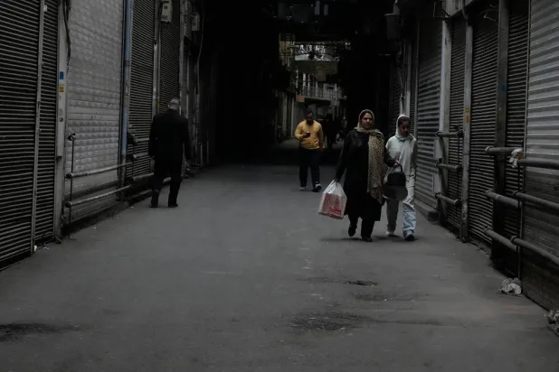  People walk past closed shops at the nearly empty traditional main bazaar during Iranian New Year, or Nowruz, holidays in Tehran, Iran, Sunday, March 29, 2026. (AP) 