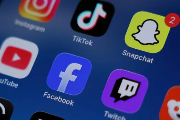 Instagram, TikTok, Snapchat, YouTube, Facebook, Twitch and Reddit applications are displayed on a mobile phone ahead of new law banning social media for users under 16 in Australia, in this picture illustration taken on December 9, 2025. (Reuters)