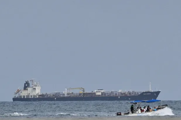 This view shows the crude oil tanker Sea Horse, flag of Hong Kong and carrying about 200,000 barrels of Russia-origin fuel originally bound for Cuba, at the coast of Puerto Cabello, Venezuela, on March 29, 2026. (Photo by Maryorin Mendez / AFP)