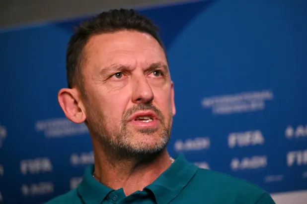 Australia's football coach Tony Popovic speaks to the media in Melbourne on March 30, 2026, ahead of their international friendly football match against Curacao. (Photo by William WEST / AFP)