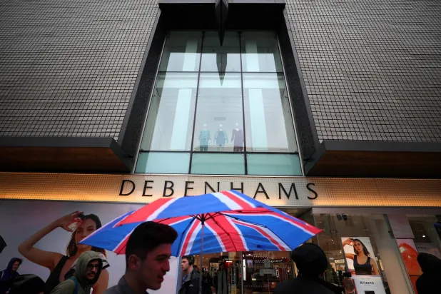 FILE PHOTO: Shoppers walk past Debenhams on Oxford Street in central London, Britain, April 2, 2018. REUTERS/Hannah McKay/File Photo