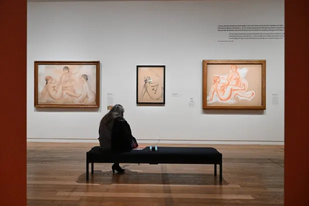 A visitor looks at works by Auguste Renoir during the press review of the exhibition 'Renoir the draughtsman at 'the Orsay museum, Monday, March 16, 2026, in Paris, France. (AP Photo/Emma Da Silva)