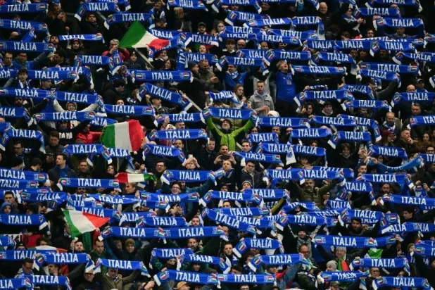 Italy's supporters cheer during the play-off FIFA World Cup 2026 European qualification semifinal against North Ireland in Bergamo on March 26, 2026. (AFP) 