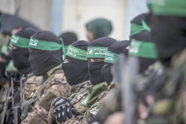 Gunmen from Hamas’ Izz ad-Din al-Qassam Brigades in Nuseirat refugee camp, central Gaza, February 2025 (EPA)