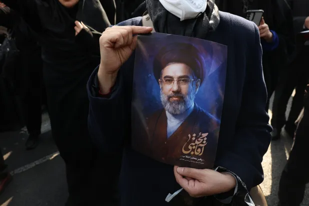 A person holds a picture of the new Iranian Supreme Leader Mojtaba Khamenei during a gathering in support of him in Tehran, Iran, 09 March 2026. (EPA) 