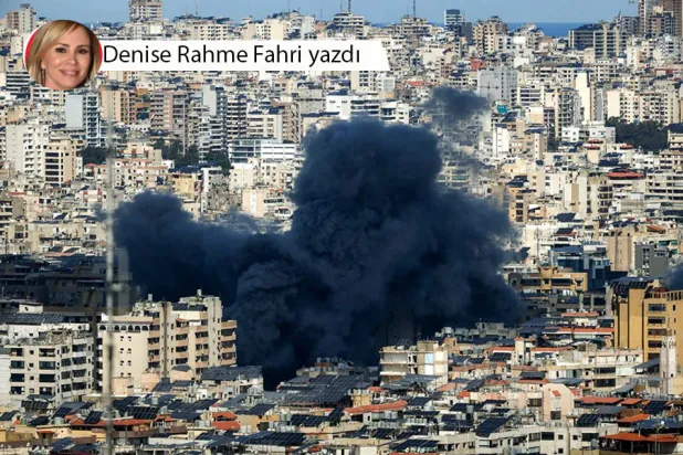 İsrail'in “El- Karz-ı Hasen” merkezine düzenlediği hava saldırısının ardından Beyrut'un güney banliyösü üzerinde büyük bir siyah duman bulutu yükseliyor, 9 Mart (AFP)