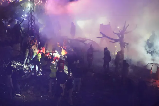 Rescue workers inspect the scene of Israeli airstrikes, in Beirut, Lebanon, Wednesday, April 1, 2026. (AP Photo/Hussein Malla)