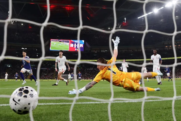 Football - International Friendly - England v Japan - Wembley Stadium, London, Britain- March 31, 2026 Japan's Kaoru Mitoma scores their first goal past England's Jordan Pickford. (Action Images via Reuters) 