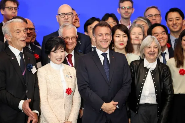  French President Emmanuel Macron poses with the Governor of Tokyo Yuriko Koike, Mouvement des Entreprises de France (MEDEF) President Patrick Martin and other attendees, at an economic forum on cooperation between France and Japan in strategic fields, in Tokyo, Japan, April 1, 2026. (Reuters)
