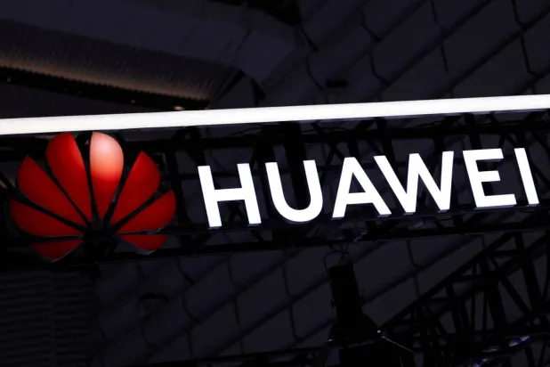 FILE PHOTO: A sign of Huawei is displayed at the company's booth at the expo of the World Internet Conference in Wuzhen town of Tongxiang city, Zhejiang province, China November 8, 2025. REUTERS/Tingshu Wang/File Photo