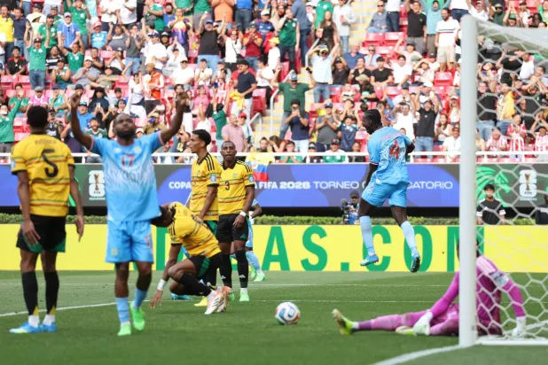 DR Congo's defender #04 Axel Tuanzebe (R) celebrates after scoring a goal in extra time during the 2026 FIFA World Cup qualifiers final playoff football match between the Democratic Republic of the Congo and Jamaica at the Akron Stadium in Zapopan, Jalisco state, Mexico, on March 31, 2026. (AFP) 
