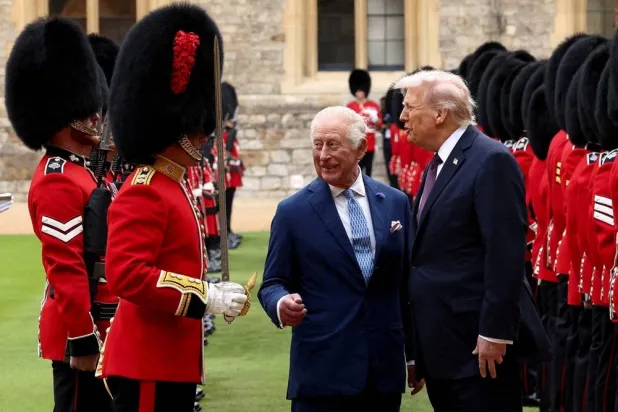 US President Donald Trump and Britain's King Charles inspect the Guard of Honor as they attend a welcome ceremony during Trump's state visit, at Windsor Castle, in Windsor, Britain, September 17, 2025. (Reuters)