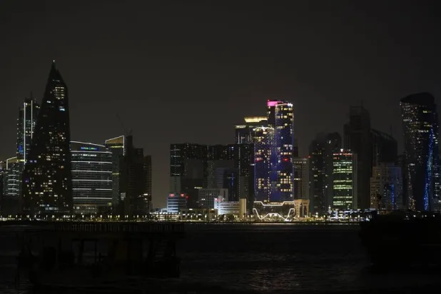 28 March 2026, Qatar, Doha: A view of the West Bay skyline in Doha with its lights switched off during Earth Hour. (dpa)