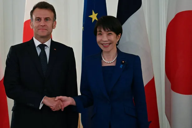 French President Emmanuel Macron shakes hands with Japanese Prime Minister Sanae Takaichi during a welcoming ceremony at the Akasaka palace in Tokyo, Japan on April 1, 2026. PHILIP FONG/Pool via REUTERS