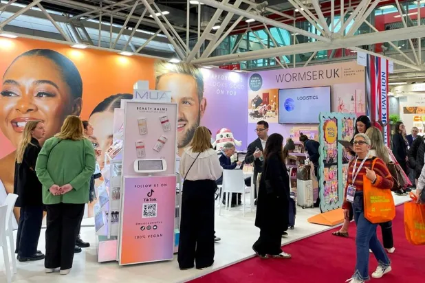 Visitors browse stalls at the beauty industry Cosmoprof trade show, in Bologna, Italy, March 26, 2026. Picture taken with a mobile phone. (Reuters) 