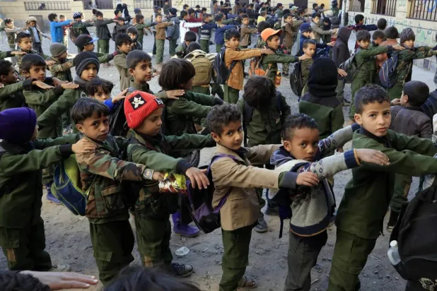 Yemeni students attend morning assembly at a school in Sanaa (EPA)