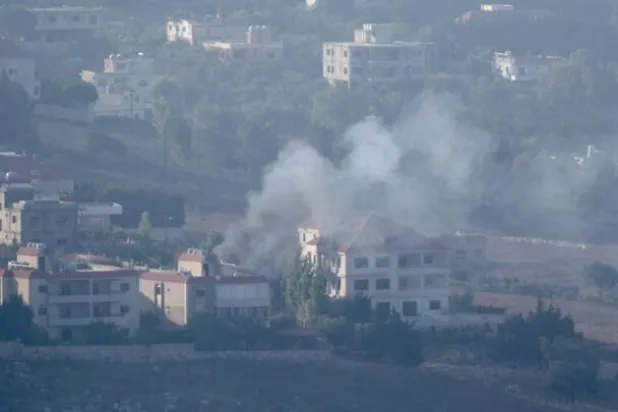 Smoke billows from an area targeted by an Israeli airstrike on the southern Lebanese village of Khiam on August 25, 2024, amid escalations in the ongoing cross-border tensions as fighting continues between Israel and Hamas militants in the Gaza Strip. (Photo by Rabih DAHER / AFP) AFP - RABIH DAHER
