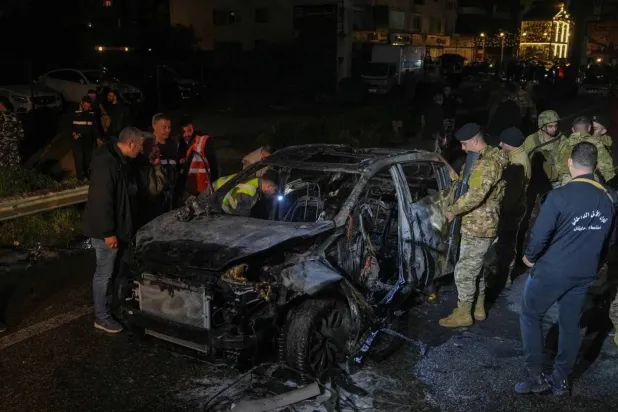 Lebanese security personnel at the site of an Israeli strike targeting senior military commander Youssef Hashem in the Jnah area on the outskirts of Beirut (Reuters). 
