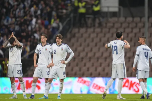 Italy players react after losing in a World Cup qualifying playoff final soccer match between Bosnia and Italy in Zenica, Bosnia, Tuesday, March 31, 2026. (Fabio Ferrari/LaPresse via AP)