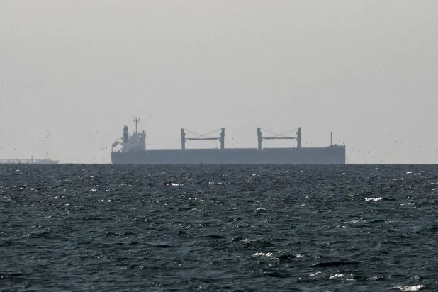 A cargo ship in the Gulf, near the Strait of Hormuz, as seen from northern Ras al-Khaimah, near the border with Oman’s Musandam governance, amid the US-Israeli conflict with Iran, in United Arab Emirates, March 11, 2026. (Reuters)