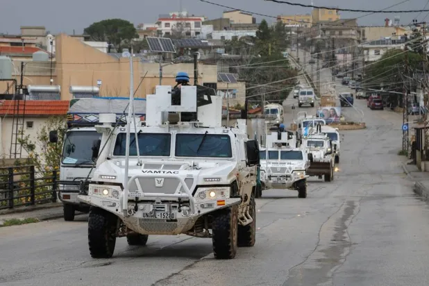  UNIFIL vehicles drive on a main road in Qlayaa, amid escalating hostilities between Israel and Hezbollah, as the US-Israel conflict with Iran continues, in Qlayaa, southern Lebanon, March 27, 2026. (Reuters)