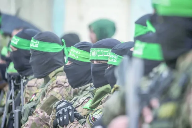 Gunmen from Hamas’ Izz al-Din al-Qassam Brigades in Nuseirat refugee camp, central Gaza, February 2025 (EPA) 