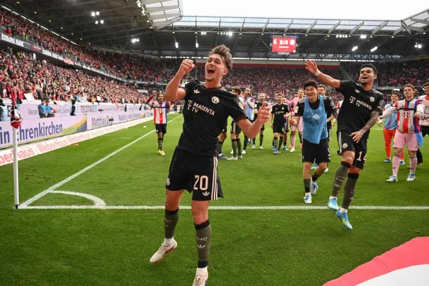 Bayern Munich players including Bayern Munich's German midfielder #20 Tom Bischof and Bayern Munich's Colombian forward #14 Luis Diaz (R) celebrate after the German first division Bundesliga football match between SC Freiburg and FC Bayern Munich in Freiburg, southern Germany on April 4, 2026. (AFP)