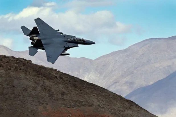 An F-15E Strike Eagle turns toward the Panamint range over Death Valley National Park, Calif., on Feb. 27, 2017. (AP)