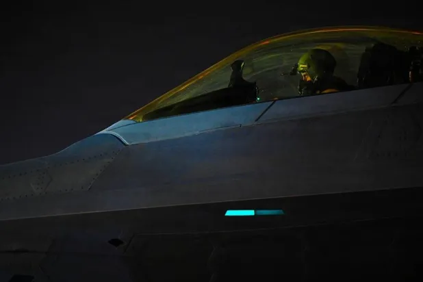  A US Air Force Airman taxis an F-22 Raptor during Operation Epic Fury in the US Central Command area of responsibility, March 15, 2026. (US Air Force/Handout via Reuters)