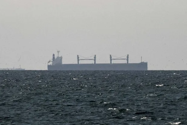 A cargo ship in the Gulf, near the Strait of Hormuz, as seen from northern Ras al-Khaimah, near the border with Oman’s Musandam, amid the US-Israeli conflict with Iran, in United Arab Emirates, March 11, 2026. (Reuters file) 