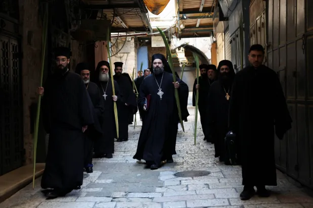  Members of the clergy make their way to the Church of the Holy Sepulchre for prayers on Palm Sunday, following restrictions on gatherings in large groups, amid the US-Israel conflict with Iran, in Jerusalem's Old City April 5, 2026. (Reuters)