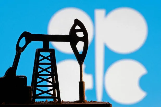 FILE PHOTO: A model of an oil pump is seen in front of the OPEC logo in this illustration taken January 9, 2026. REUTERS/Dado Ruvic/Illustration/File Photo