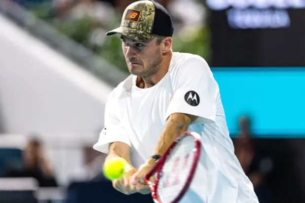 Mar 25, 2026; Miami Gardens, FL, USA; Tommy Paul of the United States hits a backhand during his match against Arthur Fils of France in the quarter finals of the men’s singles at the Miami Open at Hard Rock Stadium. Mandatory Credit: Mike Frey-Imagn Images - Reuters